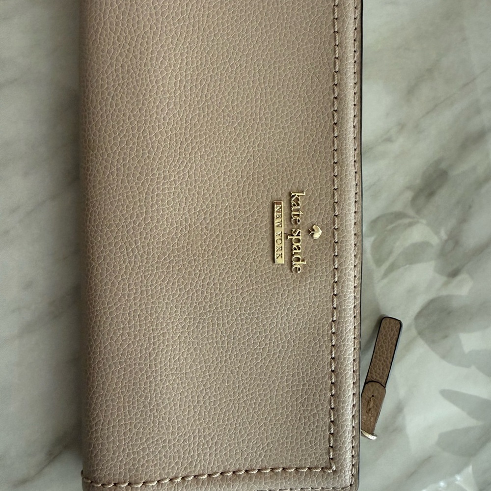 kate spade gold logo pebbled taupe leather slim bifold wallet